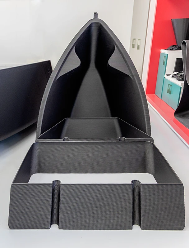 A close-up view of the fully printed 3D boat hull made from PPCF, showcasing structural detail and material strength.